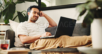 Buy stock photo Man, relax and smile with laptop in living room for movie, streaming film or listen to video. Person, home and digital tech for social media, online podcast and search for internet entertainment