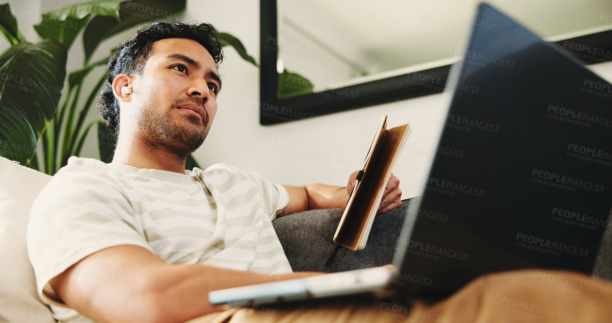 Buy stock photo Freelancer, thinking and man with laptop, home and planning for article with notebook in living room. Creative, below and journalist with tech for story, remote work and preparing for publication