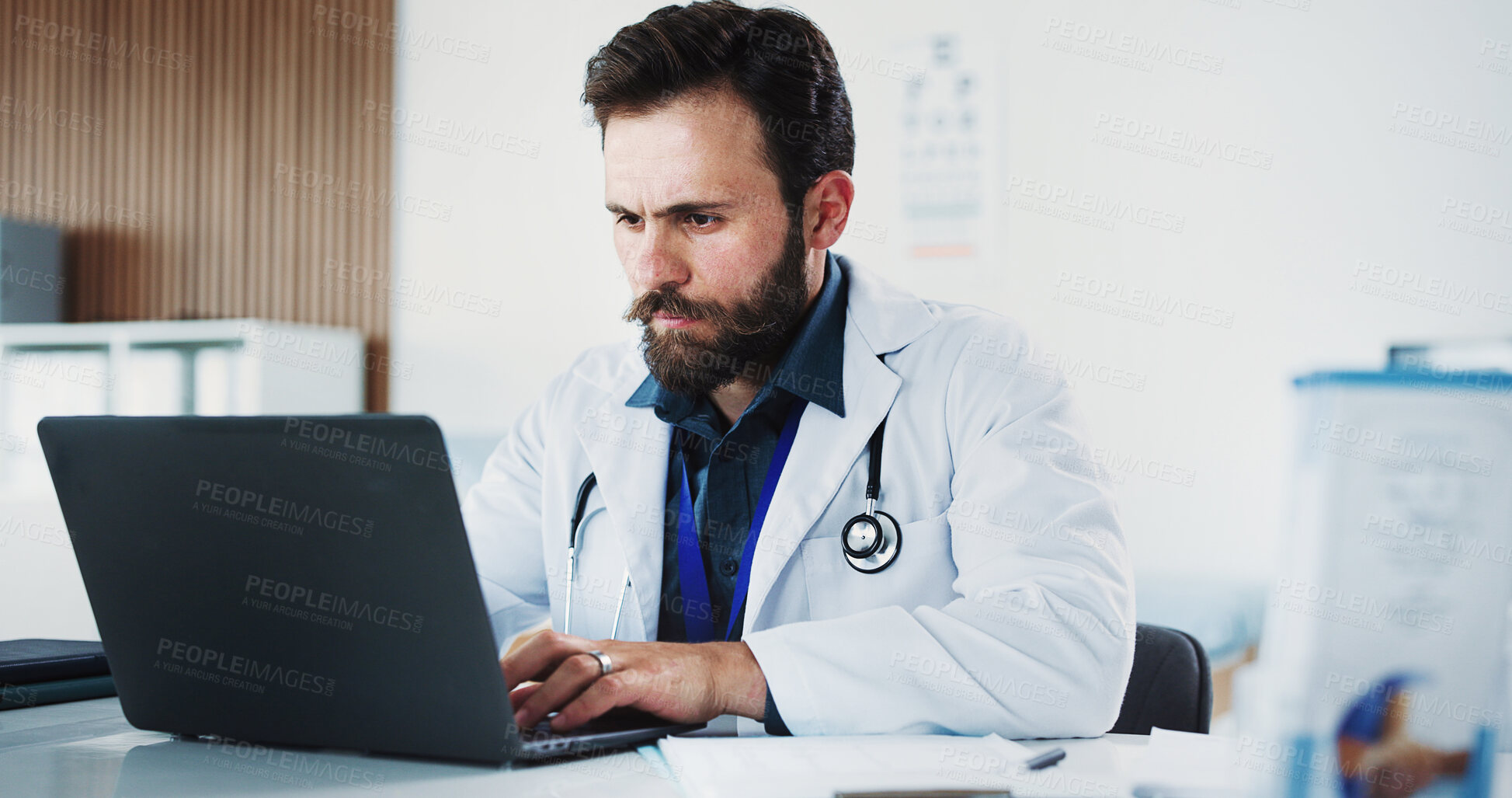 Buy stock photo Laptop, doctor or man reading in office for healthcare, digital resources or medical archive for info. Review test results, research or physician in clinic with computer, telehealth or patient admin