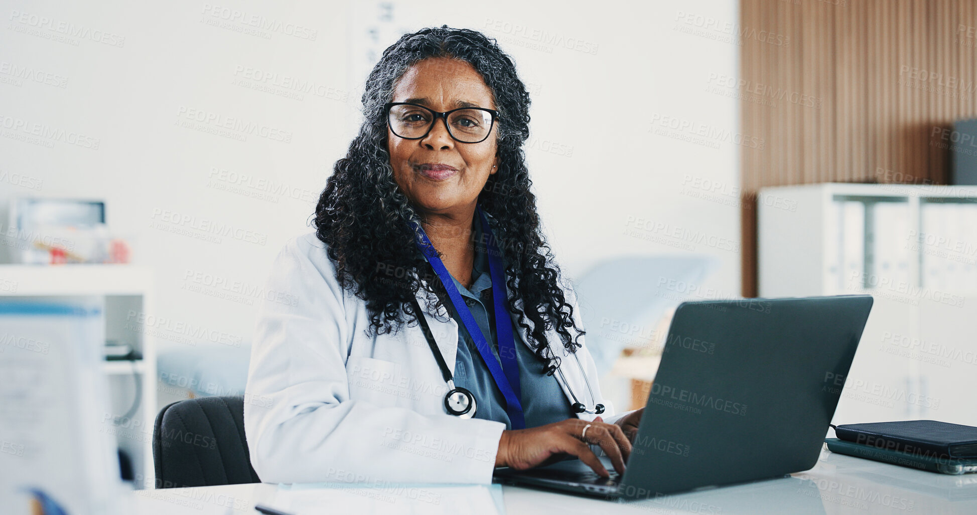 Buy stock photo Mature, black woman and portrait of doctor with laptop for medical, healthcare or admin in office. Cardiologist, professional person and tech with clinic schedule, telehealth or research for service