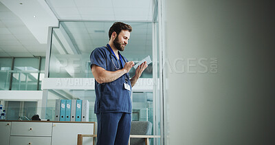 Buy stock photo Medical, reading or man in hospital with tablet, research or patient diagnosis in online consulting. Healthcare, space or doctor in clinic with tech, telehealth or client review for treatment plan.