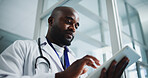 Below, black man and doctor with tablet in hospital for research, medical report and test results. Male person, reading and digital for healthcare information, treatment planning and surgery schedule