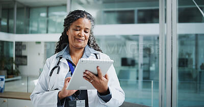Buy stock photo Medical, tablet or African woman in hospital with reading, info or patient diagnosis in online consulting. Healthcare, smile or mature doctor with tech, telehealth or client review in treatment plan