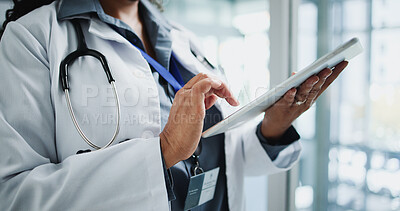 Buy stock photo Hands, doctor and reading with tablet in hospital for research, medical report and test results. Surgeon, female person and digital for healthcare information, treatment planning and surgery feedback