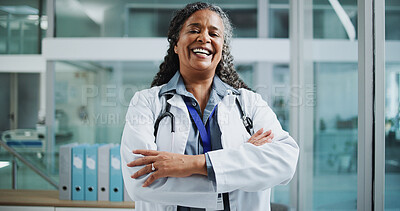 Buy stock photo Woman, doctor and portrait in hospital with confidence, about us and friendly service. Mature cardiologist, happy and black person with arms crossed for experience, medical consultation and integrity