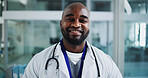 Happy man, doctor and portrait in hospital for healthcare, about us and friendly service. Cardiologist, smile and black person in clinic with experience, medical consultation and career integrity
