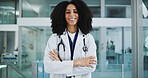 Happy, crossed arms and portrait of doctor in hospital with confidence for healthcare career. Smile, medical service and female surgeon with pride for support or expert help in lobby at clinic.