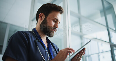 Buy stock photo Man, nurse and reading with tablet in hospital for research, medical report and telehealth. Male person, browsing and digital with healthcare information, treatment planning and schedule for surgery