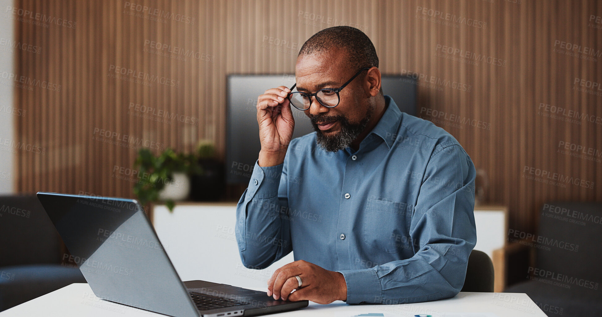 Buy stock photo Laptop, reading and business man in office for research, finance proposal and budget review. Corporate, manager and mature African person on computer for financial report, investment and planning