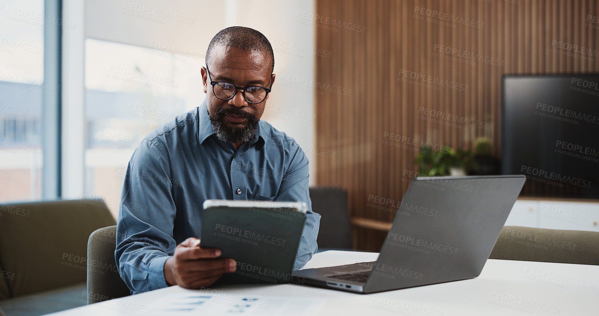 Buy stock photo Black man, accountant or tablet with laptop for finance report, expenses or audit in office. Male person, accounting or analyst with tech or documents for financial plan, budget or business revenue
