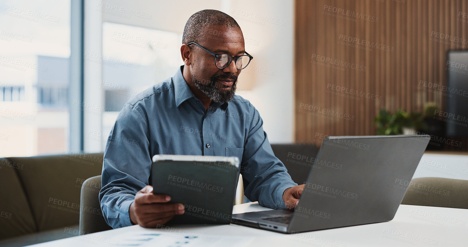 Buy stock photo Businessman, accountant or tablet with laptop for finance report, expenses or audit in office. Mature, black man or accounting with tech or documents for financial planning, budget or revenue