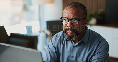 Buy stock photo Reading, business and mature black man with tech for research, financial report or budget planning. Glasses, corporate office and person on computer for online proposal, investment review and finance