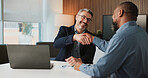 Shaking hands, agreement and business men in office for partnership, deal or collaboration. Happy, laptop and male financial advisor with client for investment contract with handshake in workplace.