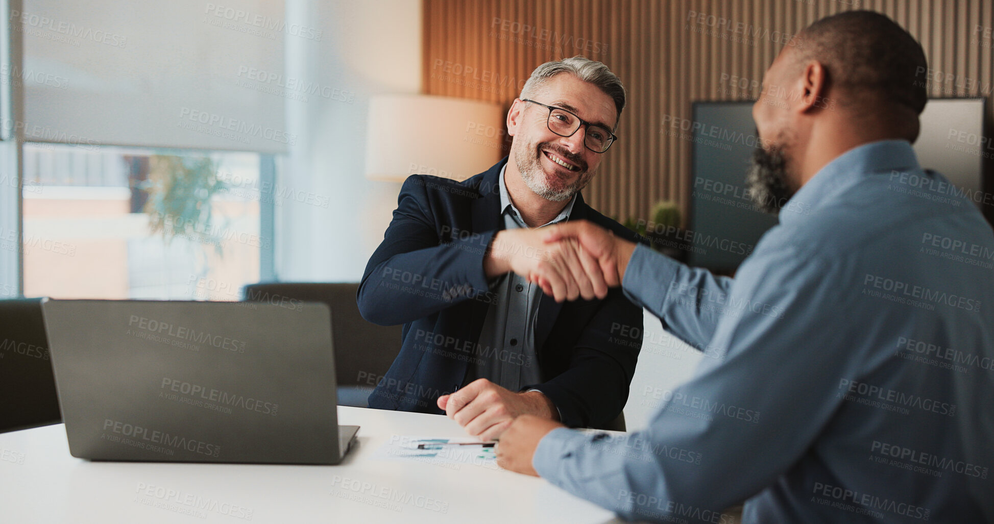 Buy stock photo Shaking hands, agreement and business men in office for finance partnership, deal or collaboration. Happy, laptop and male financial advisor with client for investment contract with handshake.