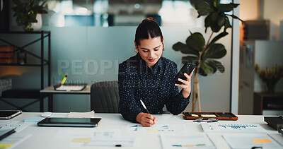 Buy stock photo Phone, business woman or writing on paperwork in office, investment model plan or market trend notes. Review, forecasting project or financial analyst with mobile for data analysis, charts or graphs