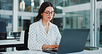 Office, typing and business woman on laptop for financial review, investment research and website. Corporate, glasses and person on computer for finance report, budget planning and expense proposal