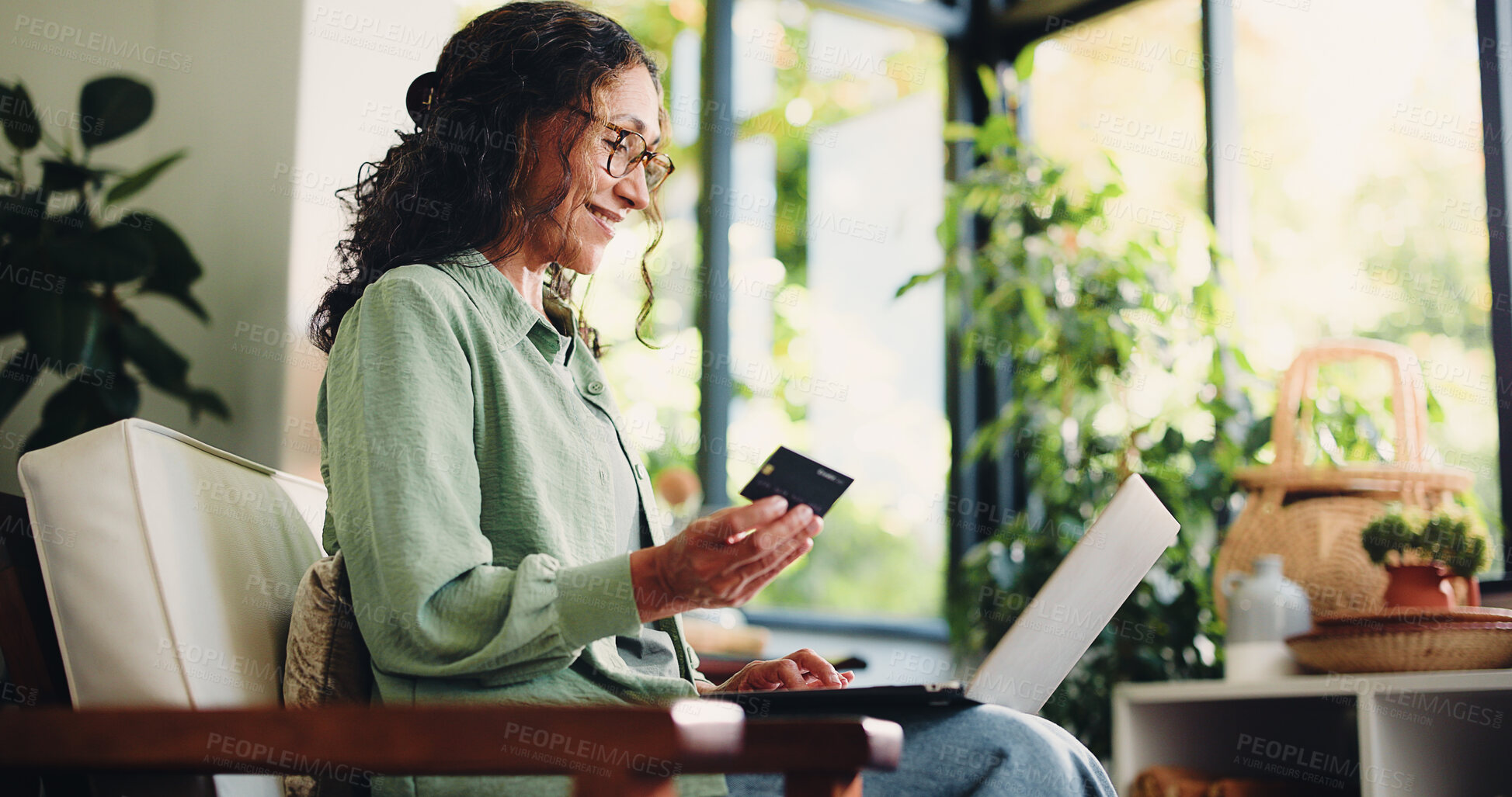 Buy stock photo Credit card, laptop and smile with woman on sofa in home for online shopping, banking app and ecommerce. Digital transaction, customer experience and fintech with mature person in living room