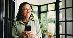 Thinking, happy and woman in home with phone for social media, communication and connection. Thoughtful, house and person smile on smartphone for typing message, contact and mobile app for website