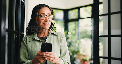 Buy stock photo Thinking, happy and woman in home with phone for social media, communication and connection. Thoughtful, house and person smile on smartphone for typing message, contact and mobile app for website