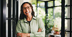 Portrait, arms crossed and woman with smile in home, confident or horticulture knowledge for career. Pride, front door or mature plant sitter with glasses for care service, about us or green advocate