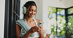 Fitness, headphones and woman with smartphone, home  and communication with contact on social media. Happy, athlete and Indian person with mobile for chat, online and subscription for music in house
