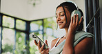 Fitness, headphones and woman with smartphone, music and subscription for entertainment or playlist. Happy, Indian person and listening to audio with tech, streaming and mobile app for song in house