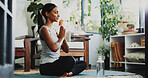 Meditation, health and prayer hands with woman in home for spiritual balance, holistic and mindfulness. Wellness, chakra and yoga with person in living room of apartment for namaste and peace