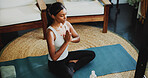 Meditation, above and prayer hands with woman in home for spiritual balance, holistic and mindfulness. Wellness, chakra and yoga with person in living room of apartment for namaste and peace