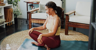 Buy stock photo Woman, yoga and thinking with mat for pilates, spiritual wellness or mental wellbeing in home. Mature, female person or yogi with smile, zen or mindfulness for health, balance or meditation in house