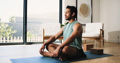 Buy stock photo Meditation, calm man or yoga mat in home for morning routine, relaxation or body awareness practice. Mindfulness, inner peace or person in lounge with mental health zen, wellness or holistic healing
