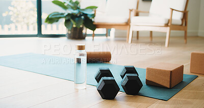 Buy stock photo House, mat and dumbbells with glass bottle for fitness training, exercise equipment and workout gear. Weights, yoga brick and water for hydration in home gym, pilates supplies and beverage on floor