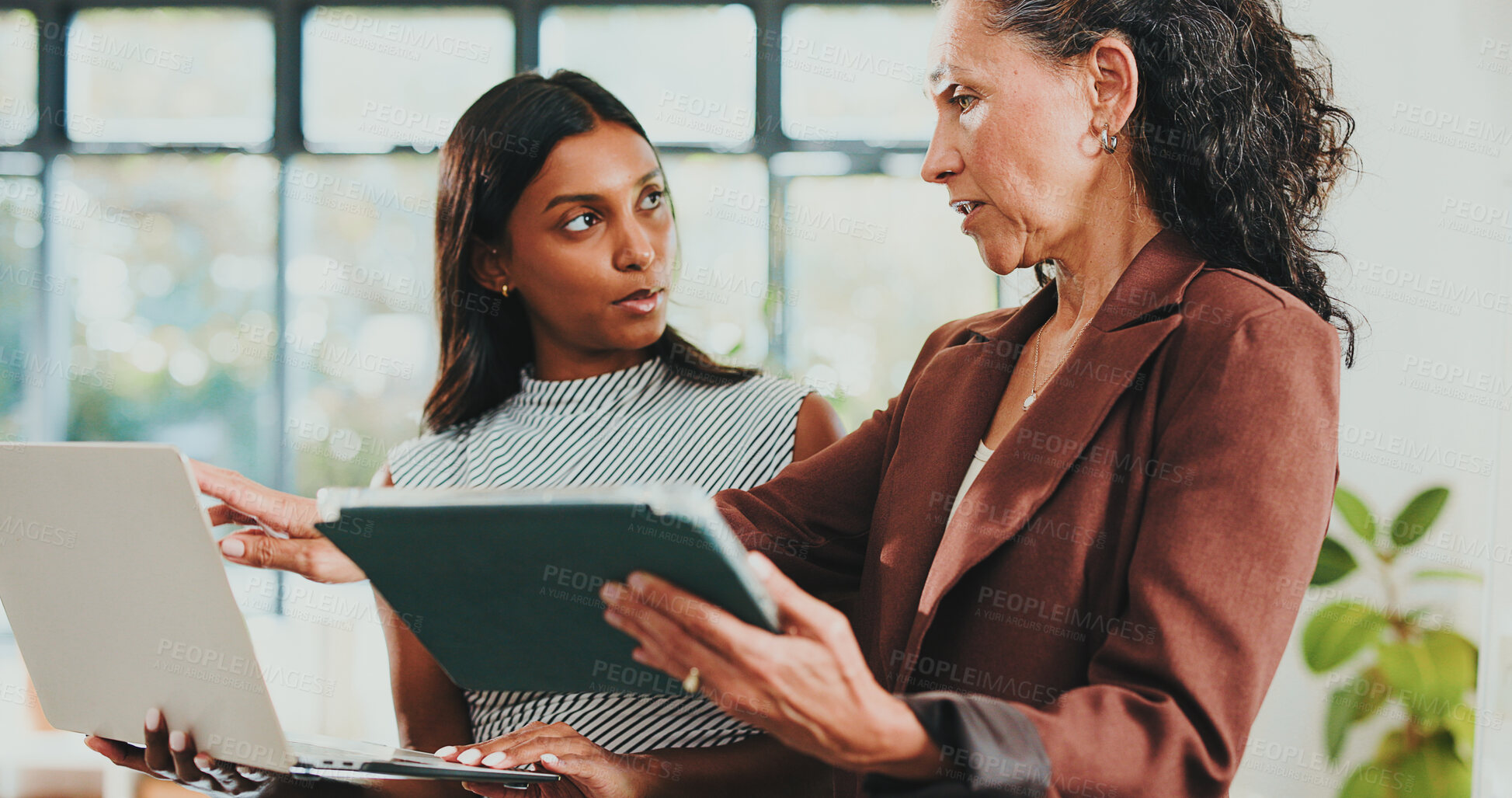Buy stock photo Creative women, discussion and tech for designer agency in office for internship or project management. App, meeting and teamwork with woman, mentor and coaching for training conversation or update