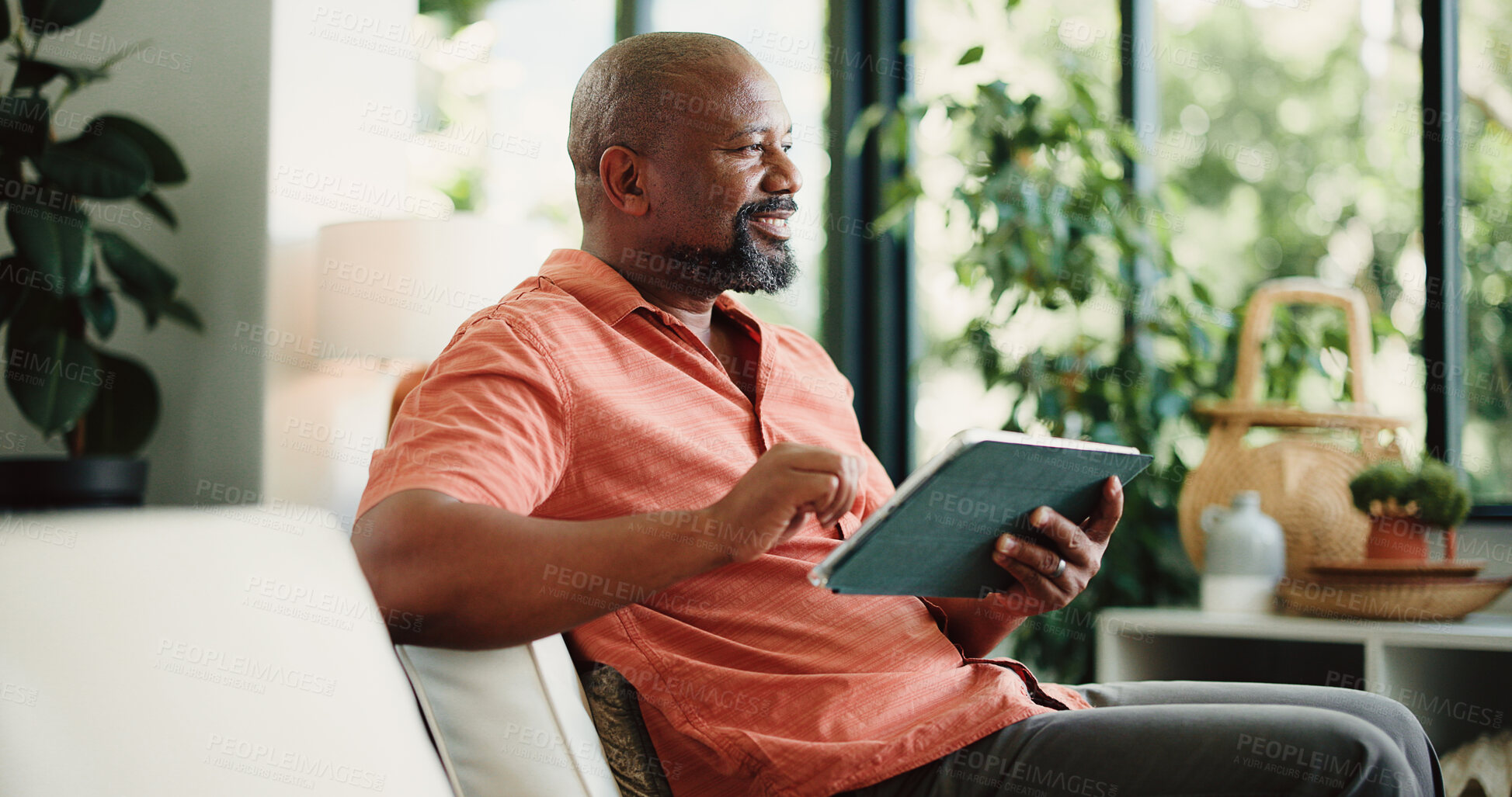 Buy stock photo Thinking, home and black man with tablet on sofa for internet, subscription and website for contact. House, thoughtful and mature person on digital tech for networking, online email and connection
