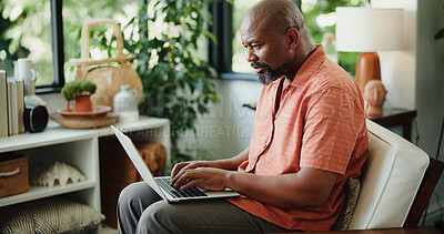 Buy stock photo Remote work, typing or journalist in house with laptop, insight or edit of news article. Freelancer, mature or black man in home with tech, proofreading or fact check for digital publication.