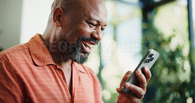 Buy stock photo Smile, reading or mature man with phone in home, internet search or social media for browsing online. Laugh, funny blog post or black person with mobile for forum discussion, comic story or message