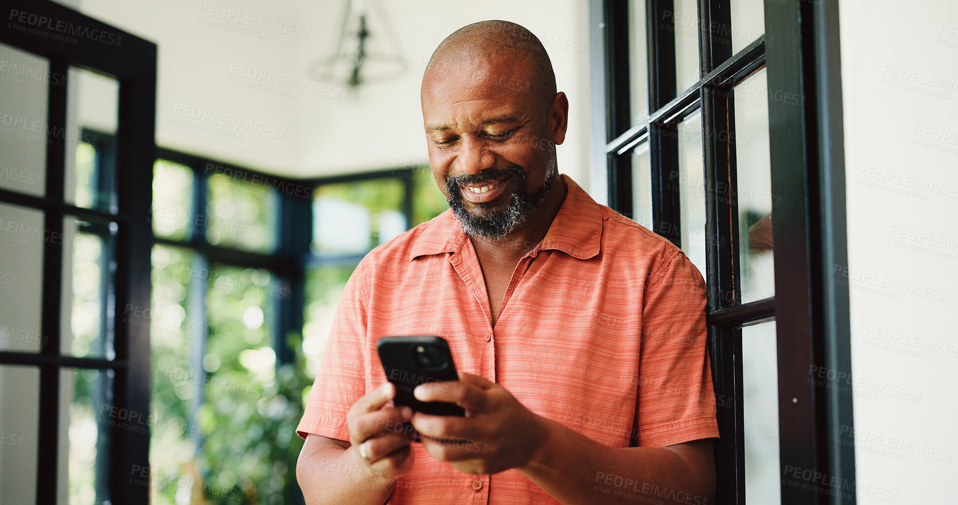 Buy stock photo Smile, reading or black man with phone in home, internet search or social media for browsing online. Happy, funny blog post or mature person with mobile for forum discussion, comic story or message
