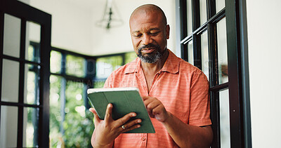 Buy stock photo Typing, home and mature black man on tablet for internet, subscription and website for contact. House, communication and person on digital tech for networking, online email and connection for news