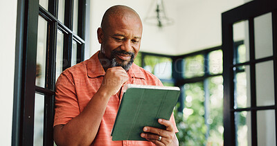 Buy stock photo Reading, home and mature black man on tablet for internet chat, subscription and website for contact. House, communication and person on digital tech for networking, online email and connection