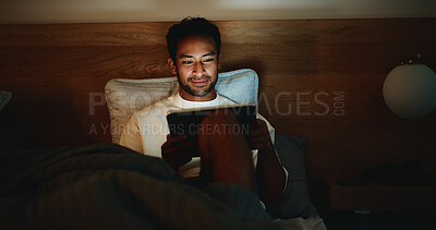 Buy stock photo Scroll, night or man in bedroom with tablet, online reading or video search on social media. Smile, dark or male person in house with tech, e book subscription or digital browse in late evening.