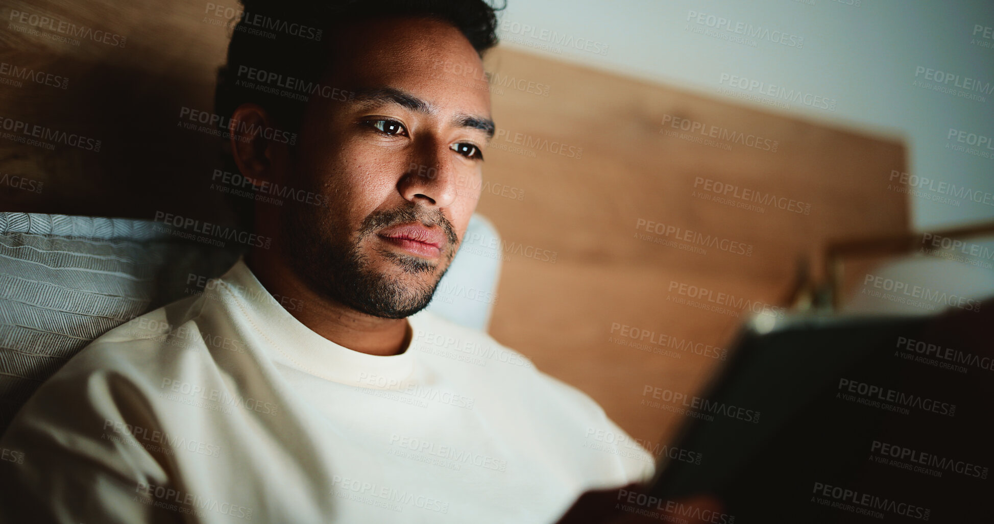 Buy stock photo Tablet, relax and man in bed in house at night for watching movie, series or film for entertainment. Digital technology, app and person streaming show online on website in bedroom in evening at home.