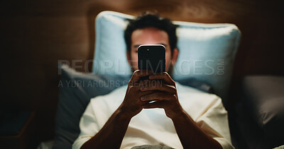 Buy stock photo Night, man and hands in home with phone for text message reply, social media post or watching video. Late, person and typing with tech in bed for online conversation, browsing internet or mobile app.