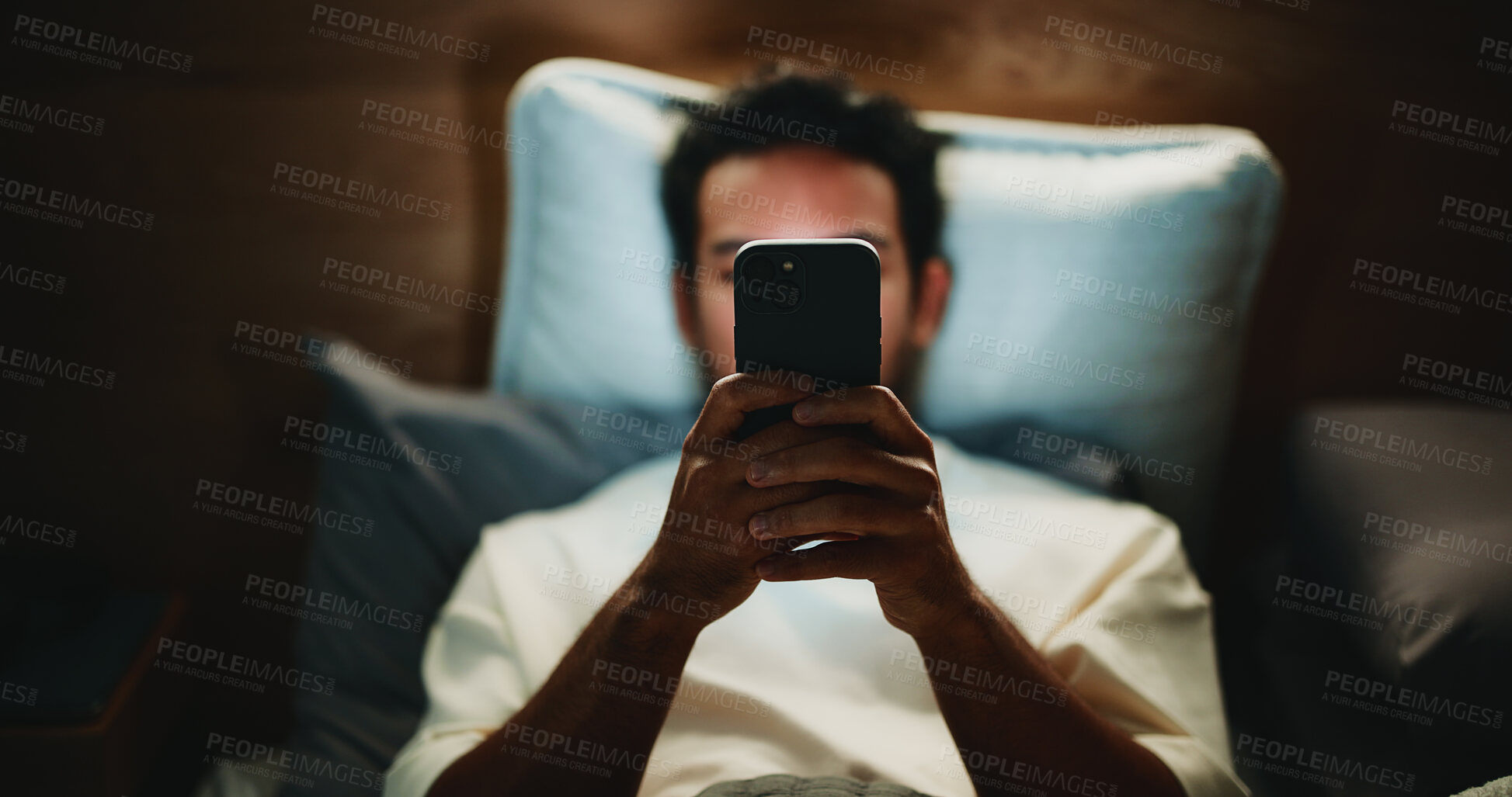 Buy stock photo Night, man and hands in home with phone for text message reply, social media post or watching video. Late, person and typing with tech in bed for online conversation, browsing internet or mobile app.