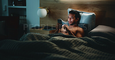 Buy stock photo Night, man and check phone in bedroom for text message reply, social media or dating site notification. Late, person and scroll with tech in apartment for online conversation, internet or mobile app.