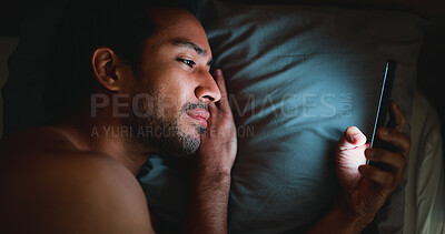Buy stock photo Night, man and lay in bed with phone for text message reply, social media and check dating site. Late, person and scroll with technology in apartment for online conversation, internet and mobile app.