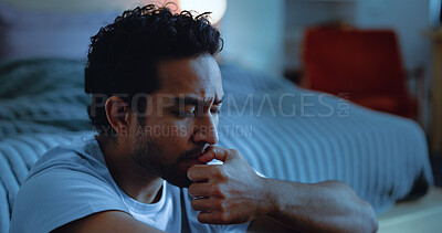Buy stock photo Night, lonely and man thinking with anxiety, mental health or insomnia from sad memories in bedroom. Late, contemplation and anxious person with grief, worry and sleepless from biting nails in house.