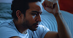 Night, worry and man thinking with anxiety, mental health or insomnia from sad memories in bedroom. Late, contemplation or anxious person with depression, grief or sleepless from stress in apartment.