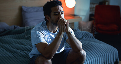 Buy stock photo Night, sad and thoughtful man with depression, mental health and insomnia from stress in bedroom. Late, contemplation and nervous person with anxiety, grief or sleepless from difficulty in apartment.
