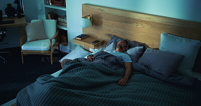 Buy stock photo Sleeping, rest and man in bed in house on weekend with exhaustion, fatigue or burnout with dreaming. Relax, calm and tired male person with nap in bedroom with blanket for comfort in apartment.