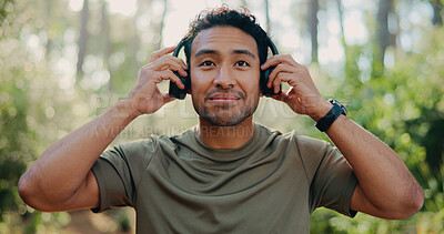 Buy stock photo Headphones, peace and fitness with man in nature for streaming service, meditation sound and calm. Workout playlist, wellness podcast and music with person outdoor for training audio and health