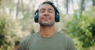 Buy stock photo Headphones, peace and health with man in nature for streaming service, meditation sound and calm. Workout playlist, wellness podcast and music with person outdoor for zen audio, radio and relax